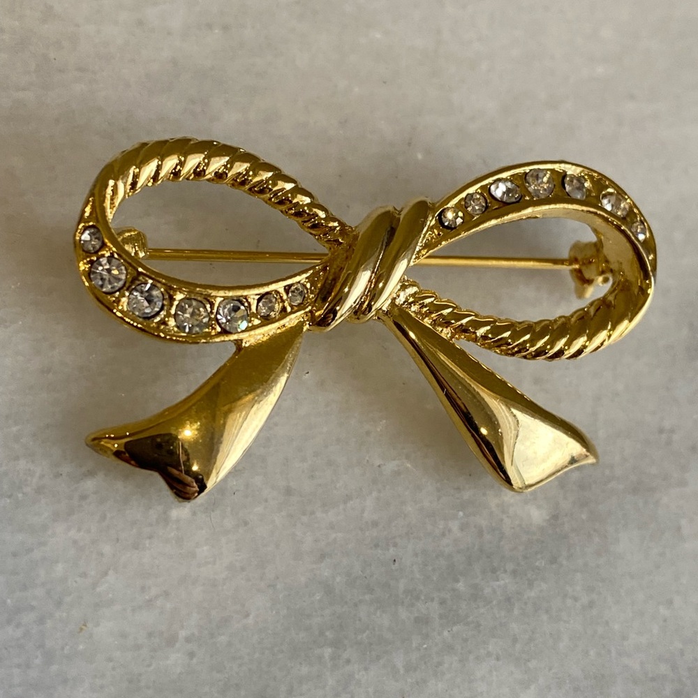 Gold tone brooch bow shape